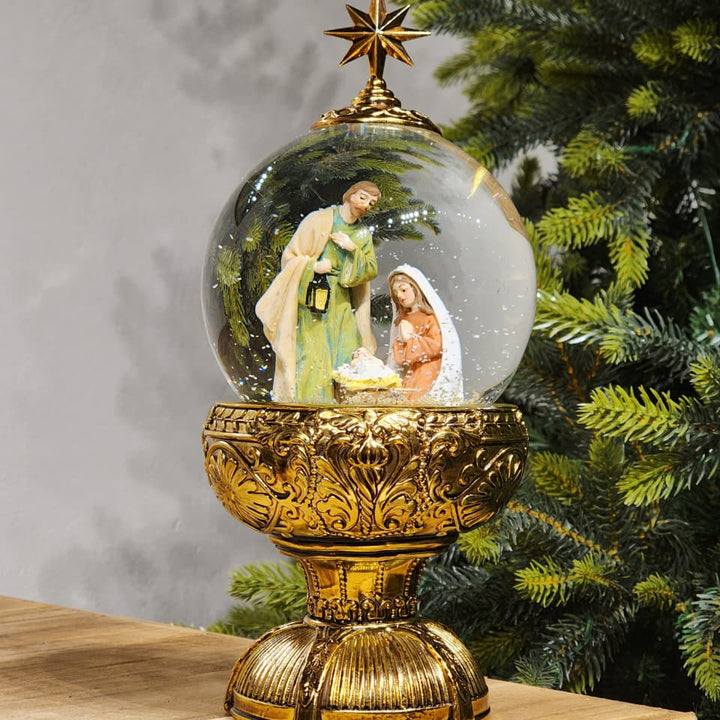 GLOBO DE NEVE COM SAGRADA FAMÍLIA DOURADO LUZ E MOVIMENTO 26,5CM
